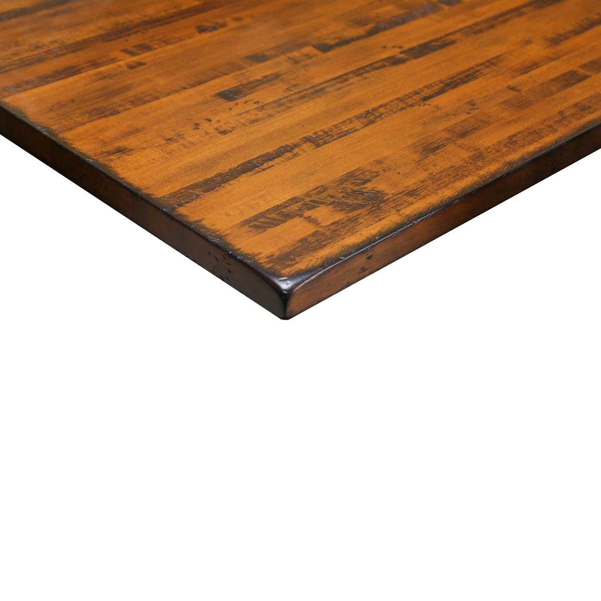 Corner detail of the 36" x 78" kitchen island top: rustic amber plank surface with hand planed saw marks and a rounded edge