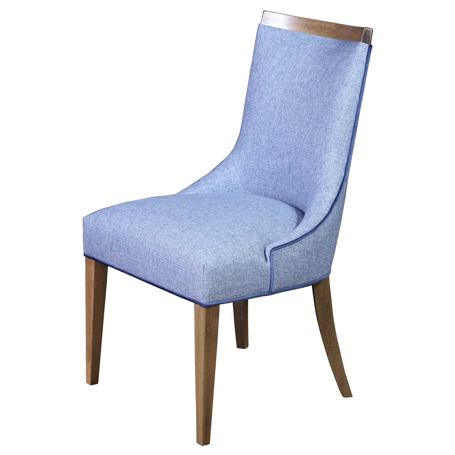 Upholstered dining chair in light blue tweed fabric with contrast piping, a wood cap crest rail and splayed legs