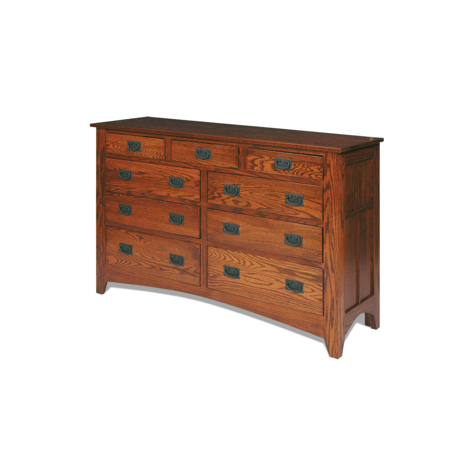 Mission oak double dresser with slatted mirror, nine drawers and black bail pulls beside a slatted bed post