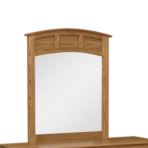 Curved panel dresser mirror in oak with an arched top rail and three small raised panel accents