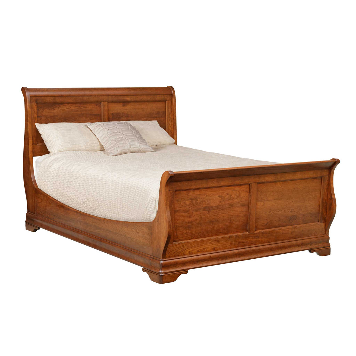 A brown wooden sleigh bed with a white mattress and pillows on it.