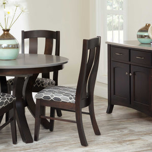 Dark espresso dining chairs with curved back slats and patterned upholstered seats at a round table