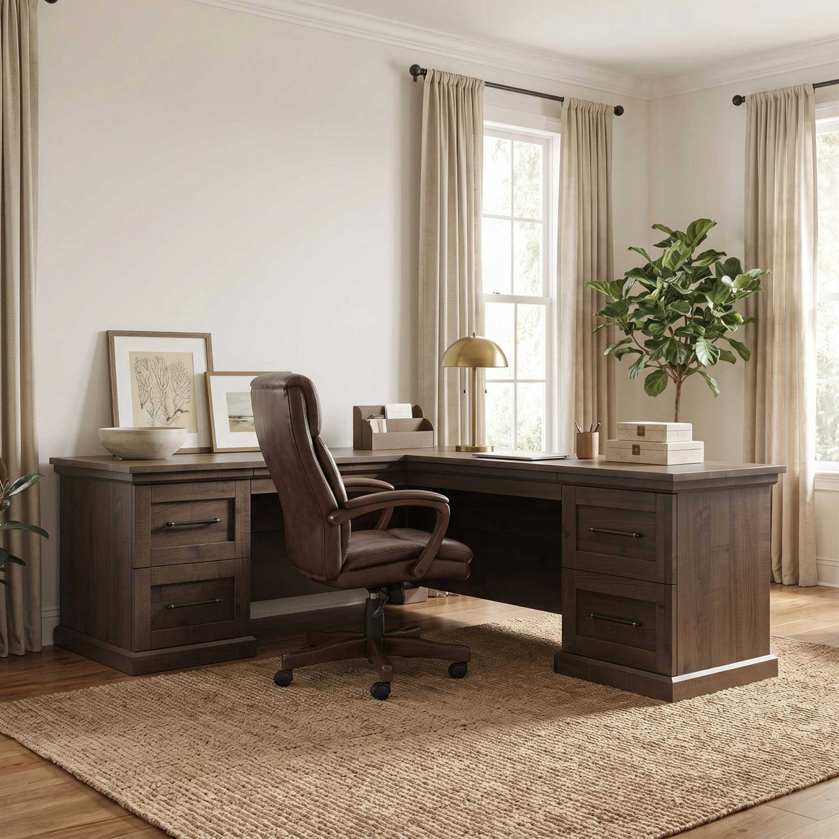 Dark wood executive L desk with drawer pedestals, leather office chair and lamp in a bright home office