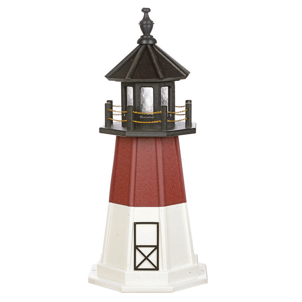 Wooden lighthouse with white base section, brick red tower, black door outline and a black lantern room with chain rail