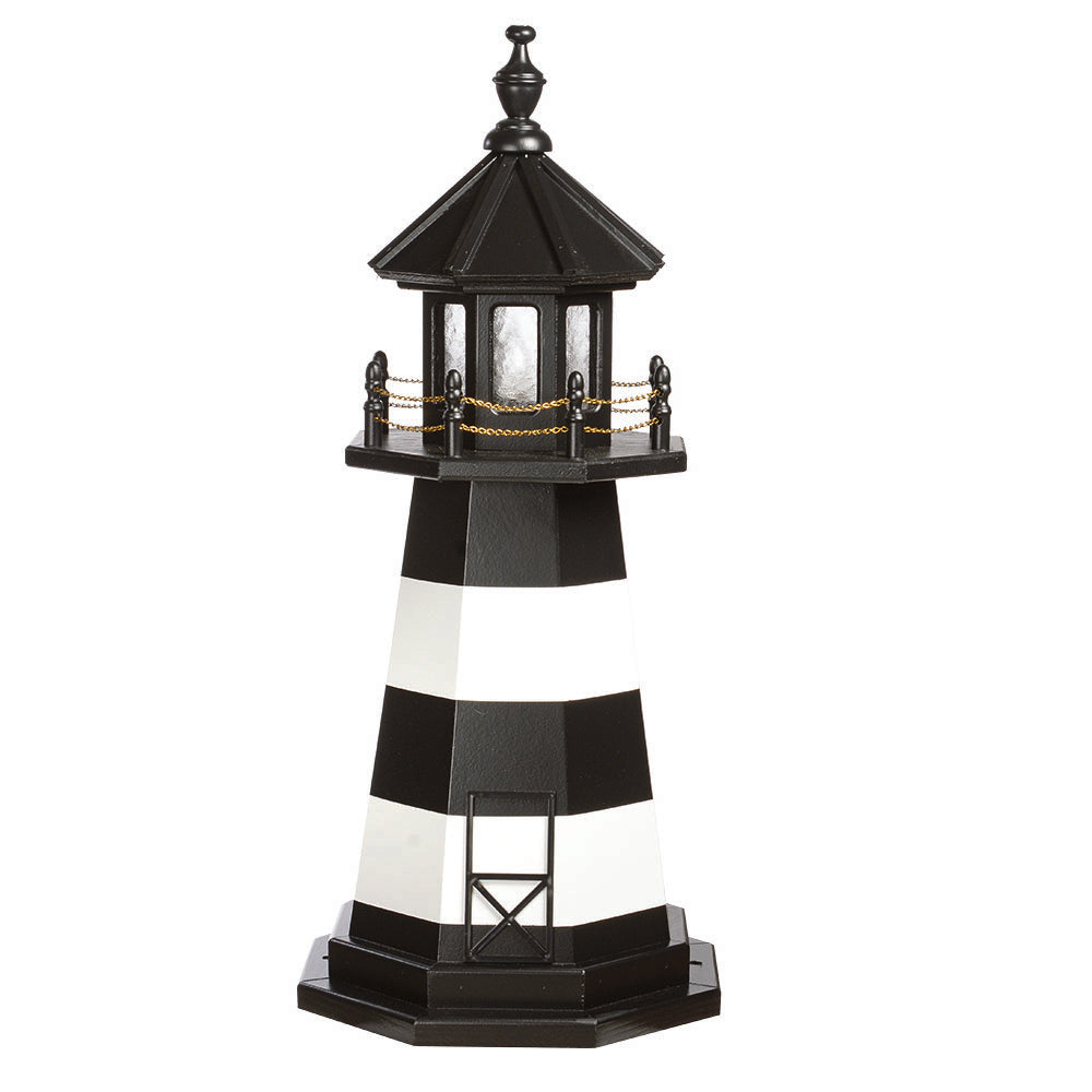 Black and white banded wooden lighthouse with black lantern room, chain railing, door outline and octagonal base