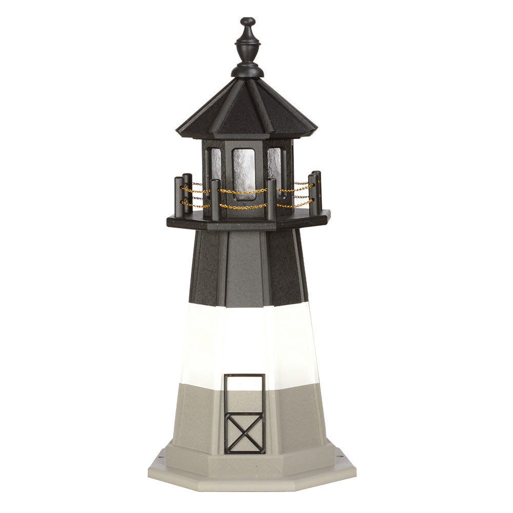 Three tone lighthouse with tan base, white band and black upper tower, black lantern room and gold chain railing