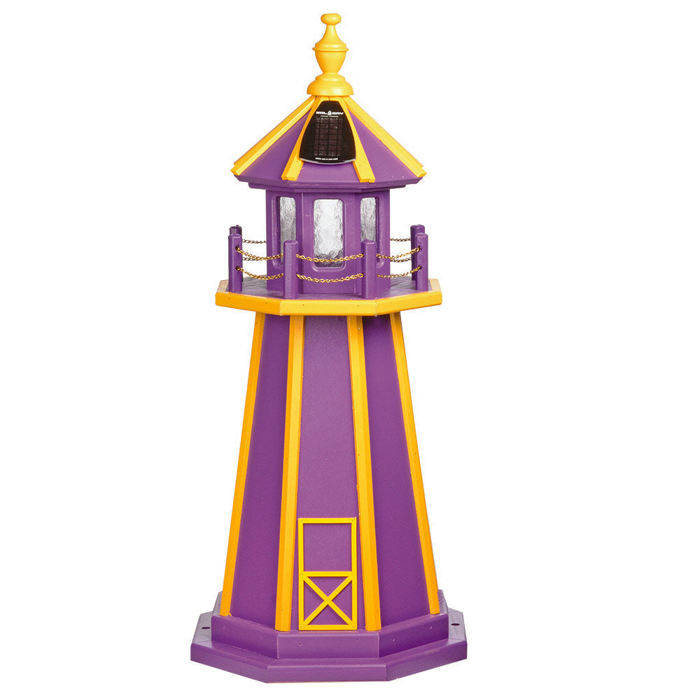 Purple wooden lighthouse with yellow corner stripes, yellow finial and trim, solar lantern room and chain railing