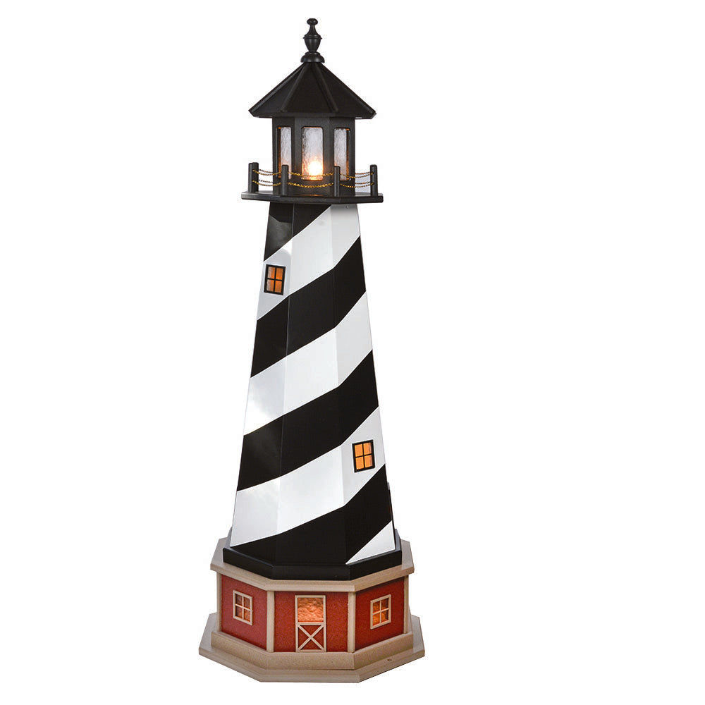 Black and white spiral striped lighthouse with glowing lantern room and lit amber windows on a red brick base