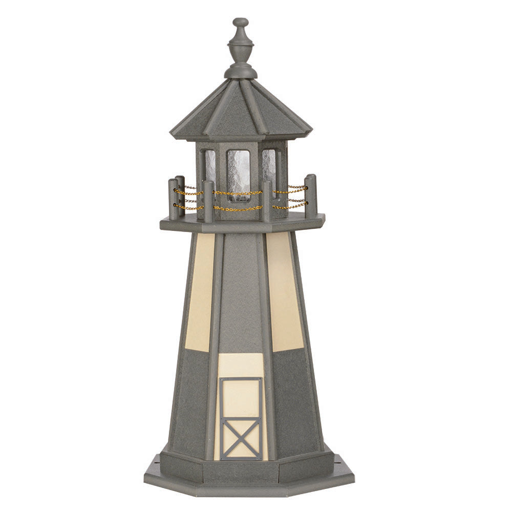 Gray wooden lighthouse with ivory corner panels and door, gray lantern room with chain railing and turned finial