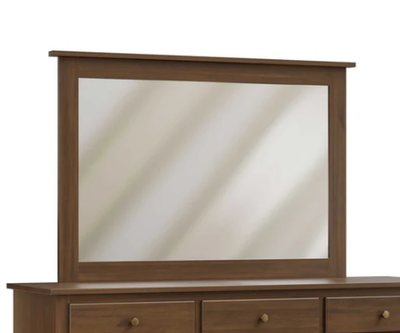 Wooden dresser with a large mirror on a white background
