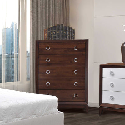 Five drawer chest in cherry with silver ring pulls styled by a window beside a white two tone nightstand