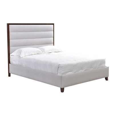 Upholstered landscape bed with tall horizontal channel headboard in ivory fabric framed by a dark wood surround