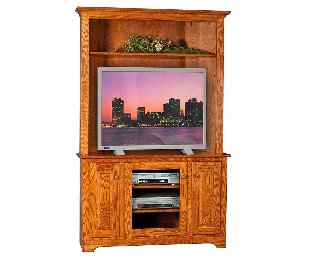 Tall oak corner entertainment center with hutch, open upper display shelf and lower cabinet with glass center door and media shelves