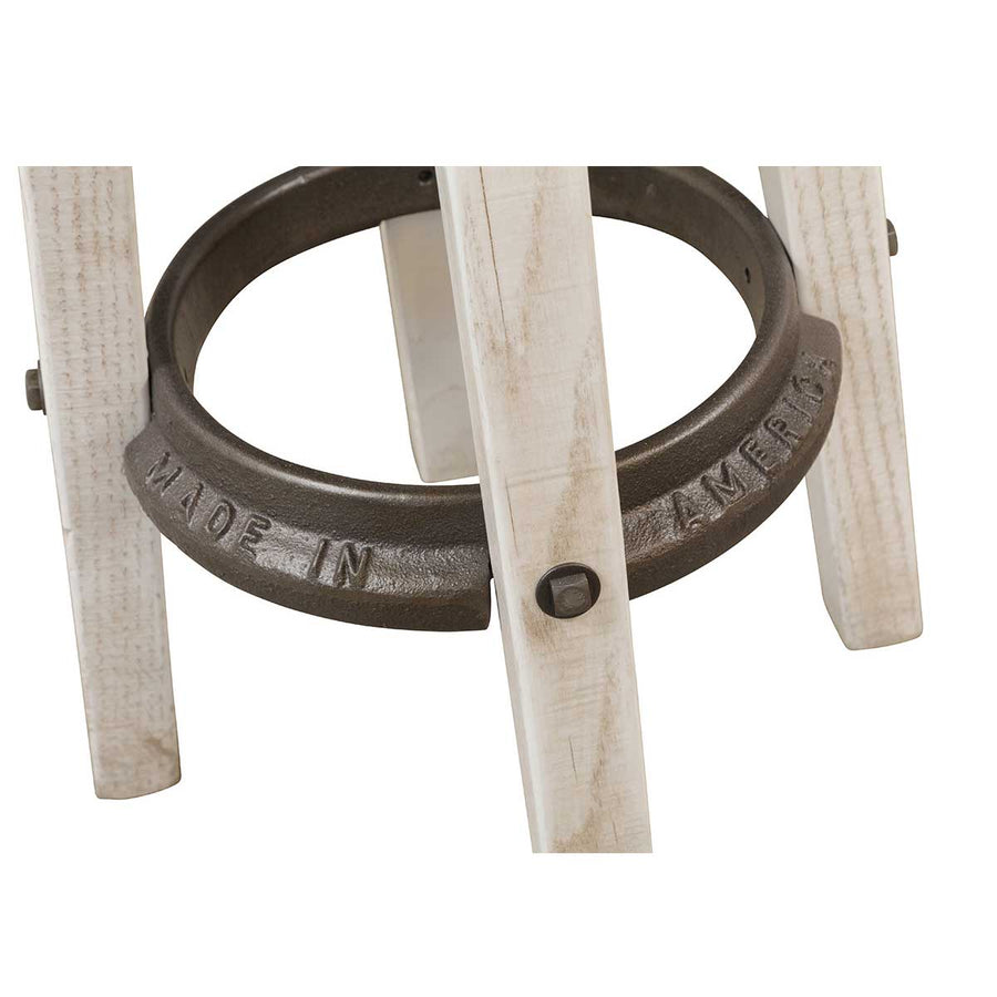 Detail of the swivel stool base showing the Made in America cast iron foot ring bolted to whitewashed legs
