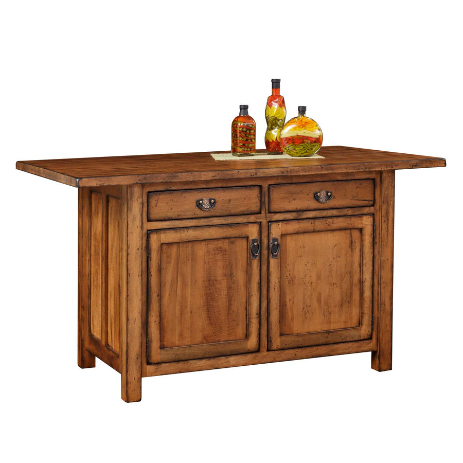 Rustic honey oak kitchen island with two drawers, two panel doors and a drop leaf top styled with oil bottles