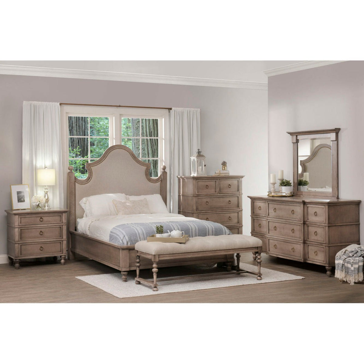 Six piece bedroom set with arched upholstered bed, nightstand, chest, dresser with mirror and bench in weathered driftwood