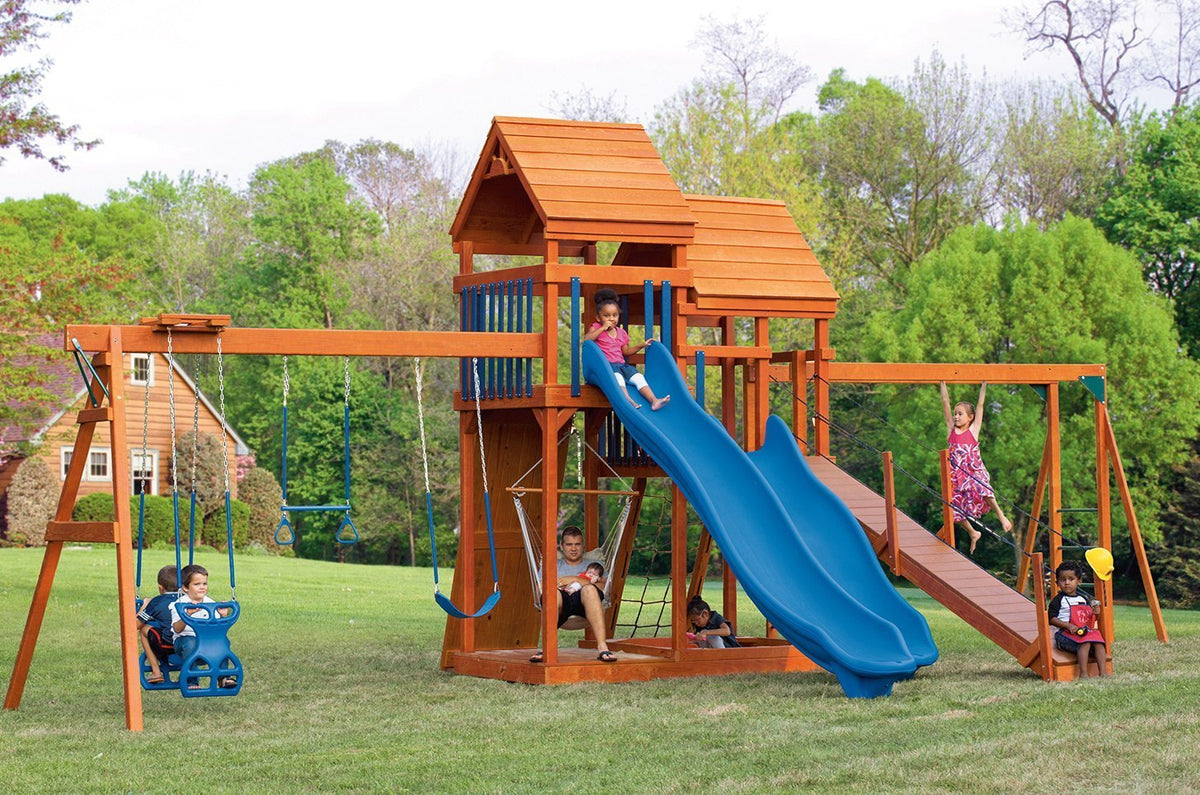 Castle Wooden Swing Set & Playset Kit – real-world photo (configuration and colors may differ from the layouts offered)