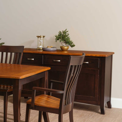 Espresso three-door dining buffet with a natural oak top, three drawers and arched panel doors next to a table