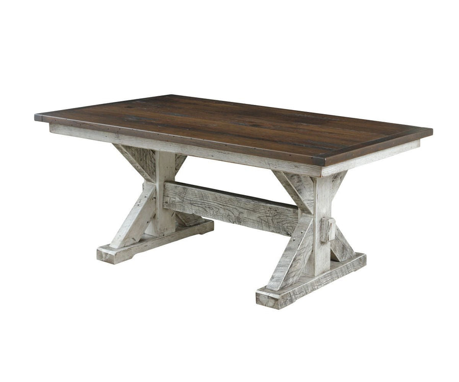 Rustic trestle dining table with a dark stained plank top and distressed white X shaped trestle base