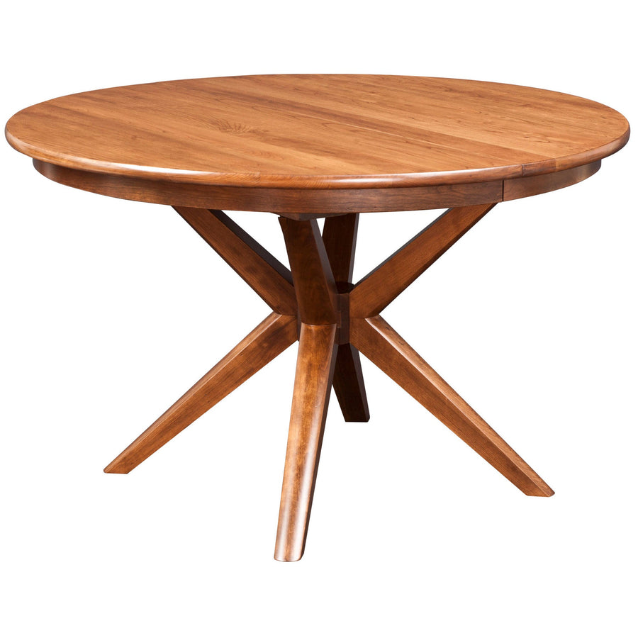 Round expandable dining table in a warm maple finish on a sculptural crossed X pedestal base