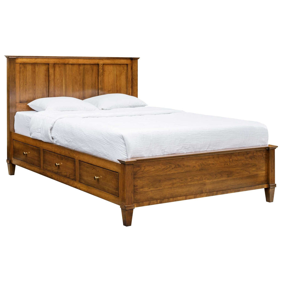 Panel storage platform bed in cherry with three brass-knobbed drawers along the side rail and low footboard