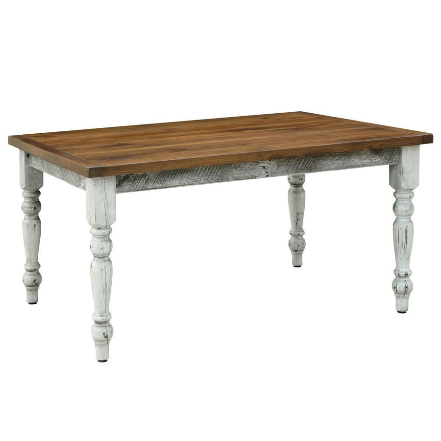 Rustic turned leg dining table with a warm stained plank top and distressed white legs and apron