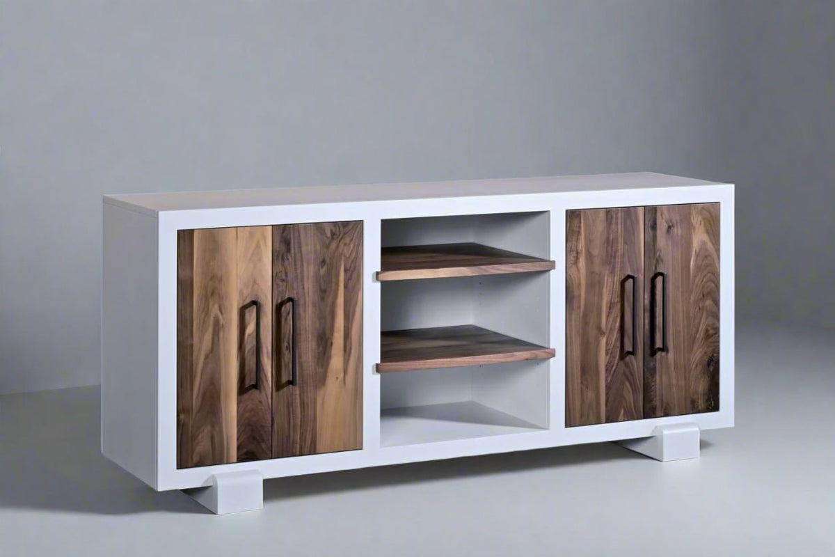 White media tv console with live edge walnut cabinet doors, two open center shelves and black bar pulls on block feet