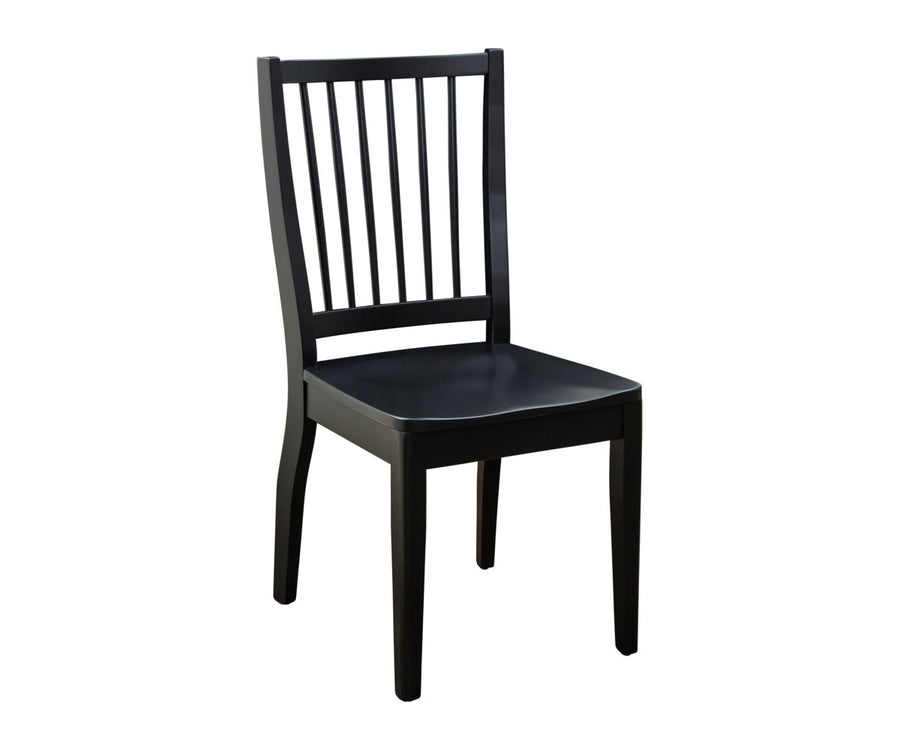 Black painted dining chair with seven vertical back slats, contoured wood seat and tapered legs on white
