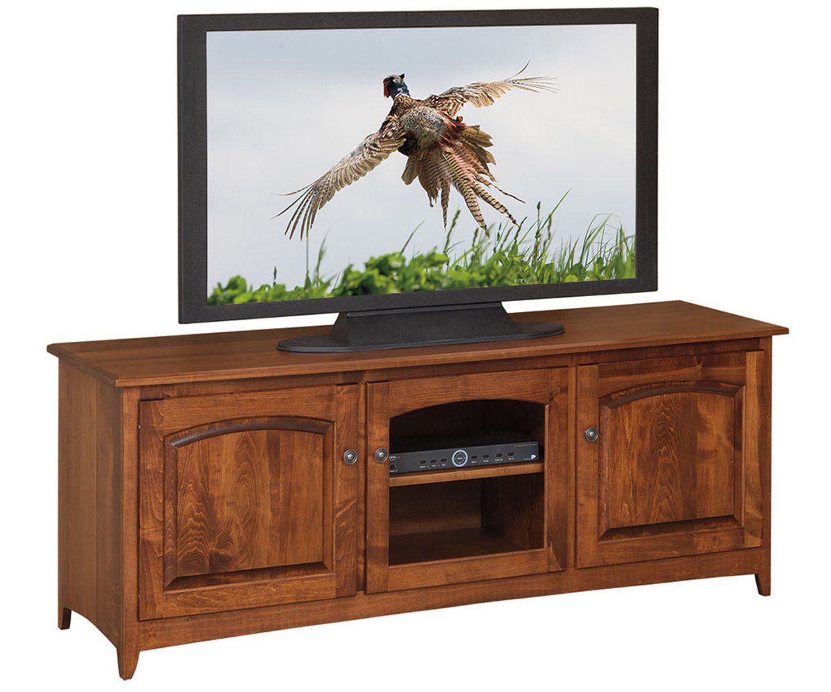 Brown maple TV stand with two arched raised panel doors and an open center bay holding an audio receiver and shelf
