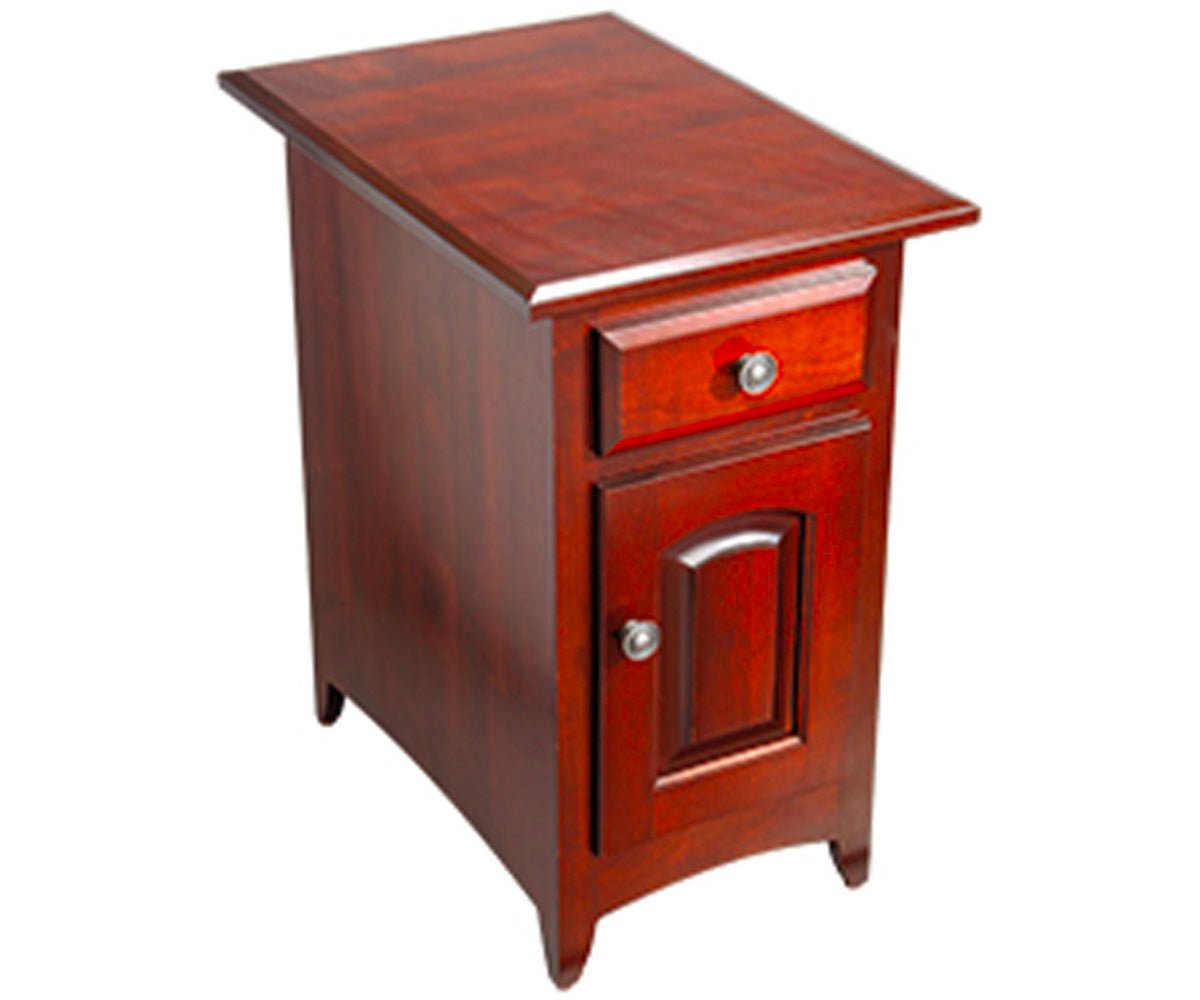 Cherry chairside end table with a small drawer, arched panel door and flared legs, shown from the side on white