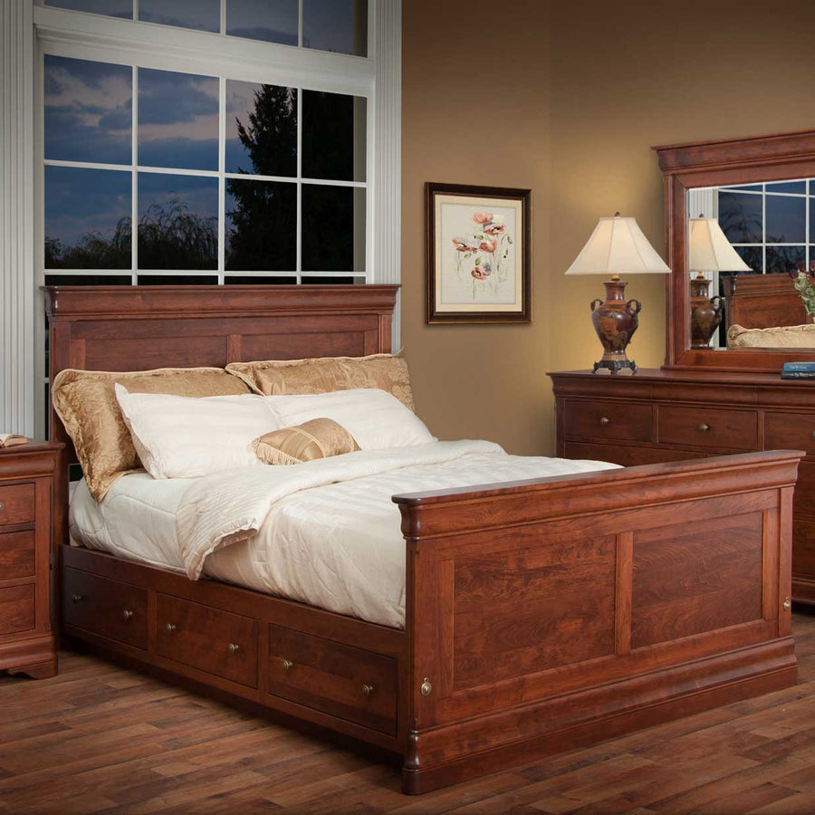 Cherry storage panel bed with three under-bed drawers, raised panel footboard and a matching dresser with mirror