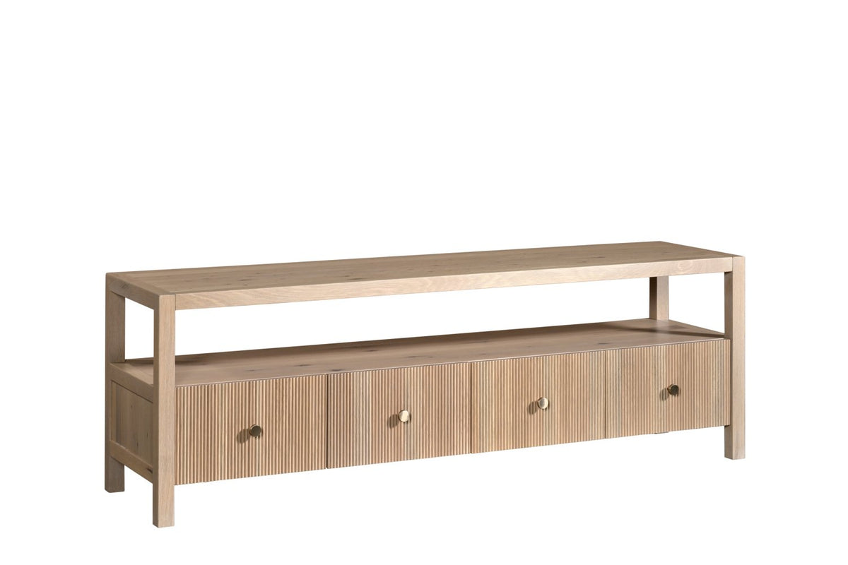 Media tv console in light washed oak with four fluted drawer fronts, round knobs and a long open shelf above