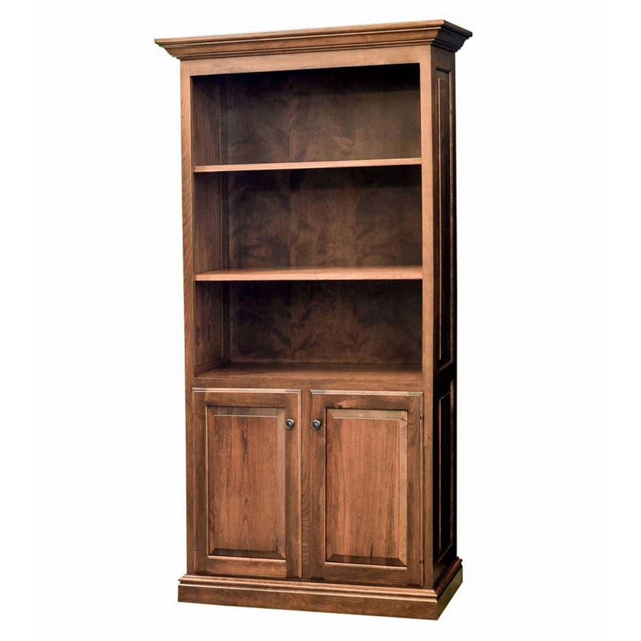 Bookcase with doors in warm cherry, three upper shelves, two paneled lower doors and molded cornice