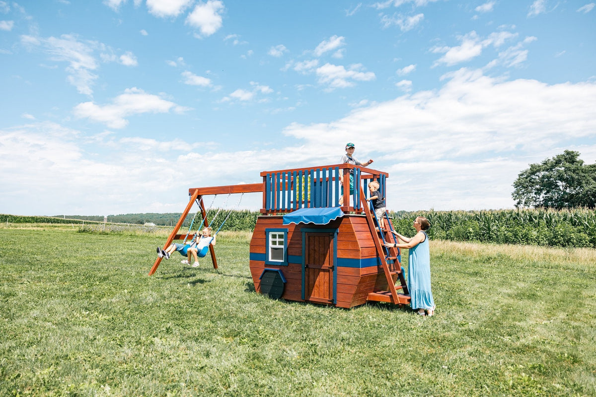 Scout Camper Wooden Swing Set & Playset Kit – real-world photo (configuration and colors may differ from the layouts offered)