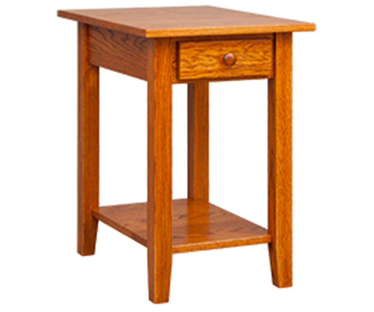 Narrow oak chairside table with one drawer, round wood knob, lower shelf and tapered legs on a white background
