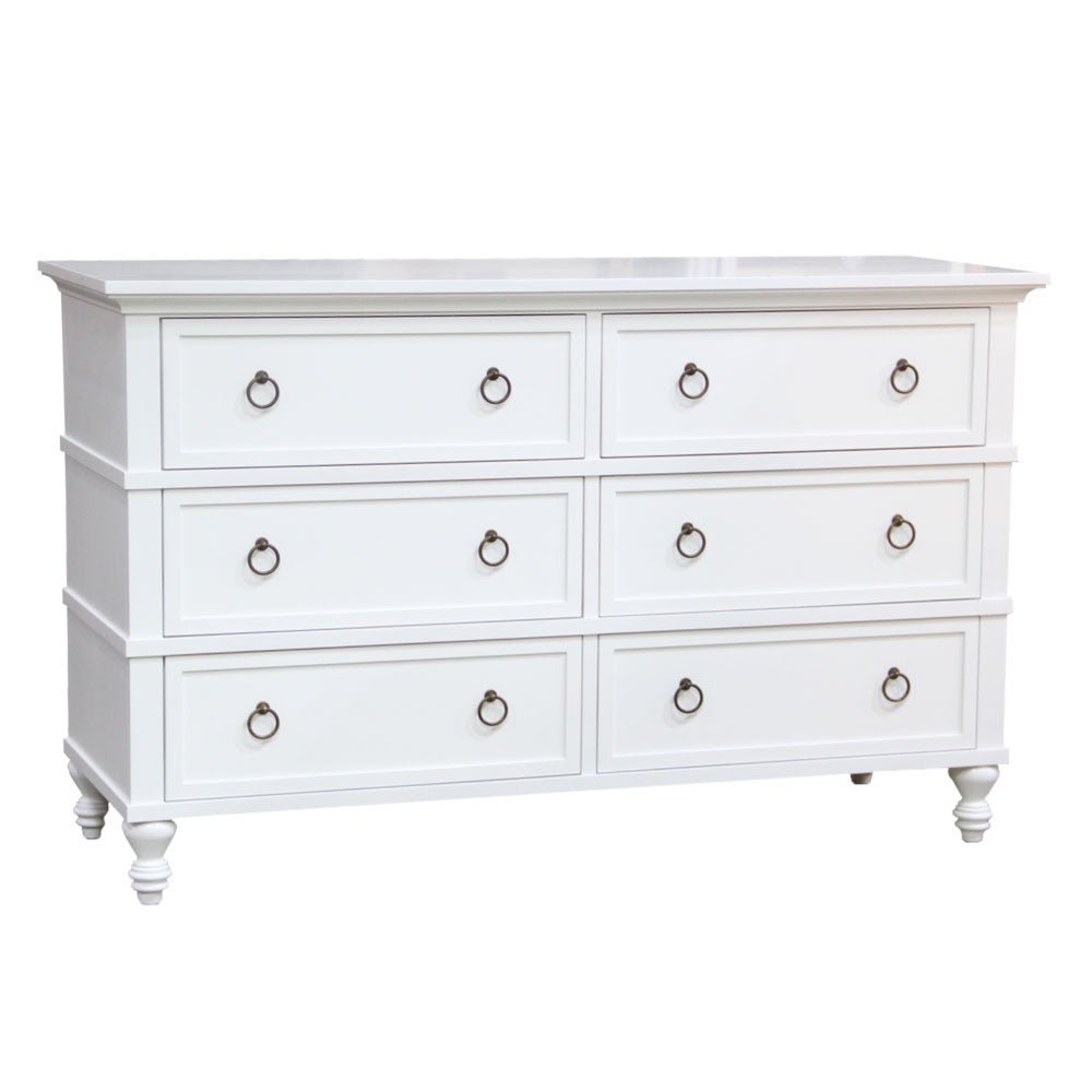 White painted six-drawer dresser with recessed panel drawer fronts, bronze ring pulls and turned bun feet