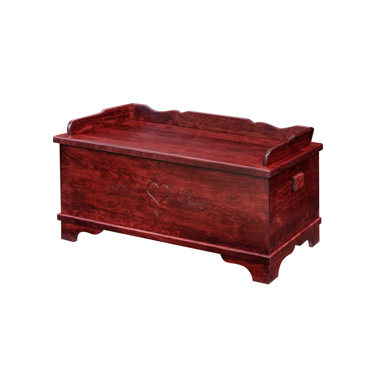 Red stained hope chest with carved heart motif, curved gallery back and cutout bracket feet on white