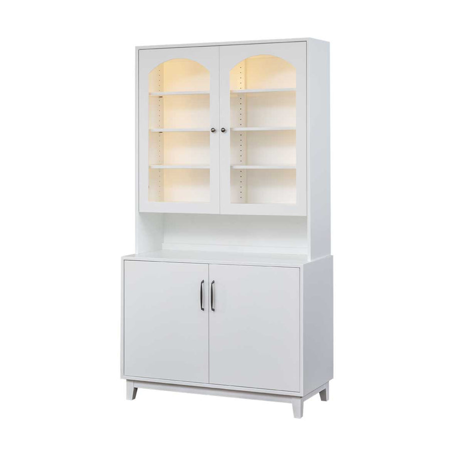 White mid century dining hutch with two arched glass doors over lighted shelves and a two door base cabinet on white