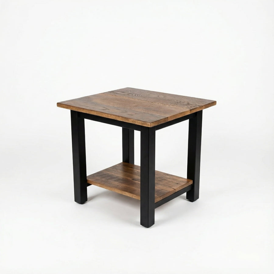 Wooden side table with black legs on a white background