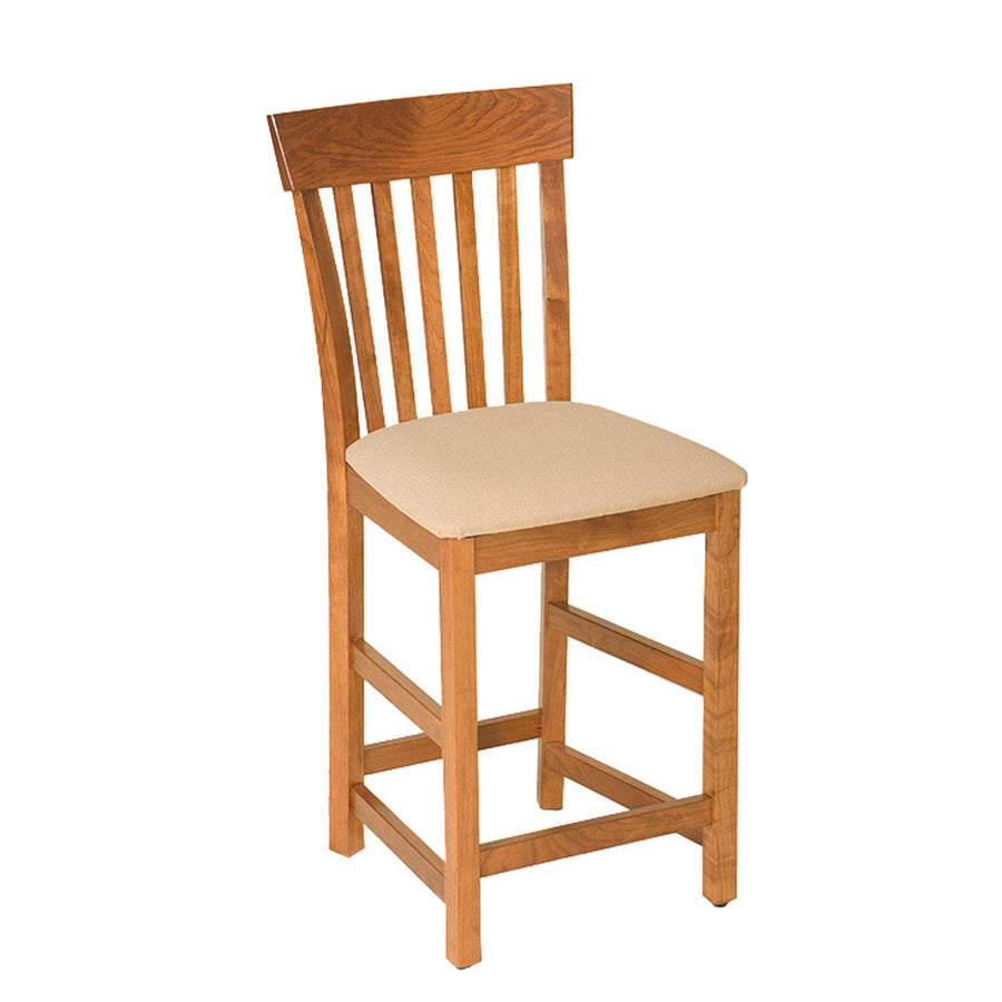 Cherry counter height bar chair with a slat back, cream upholstered seat and footrest rungs on a white background