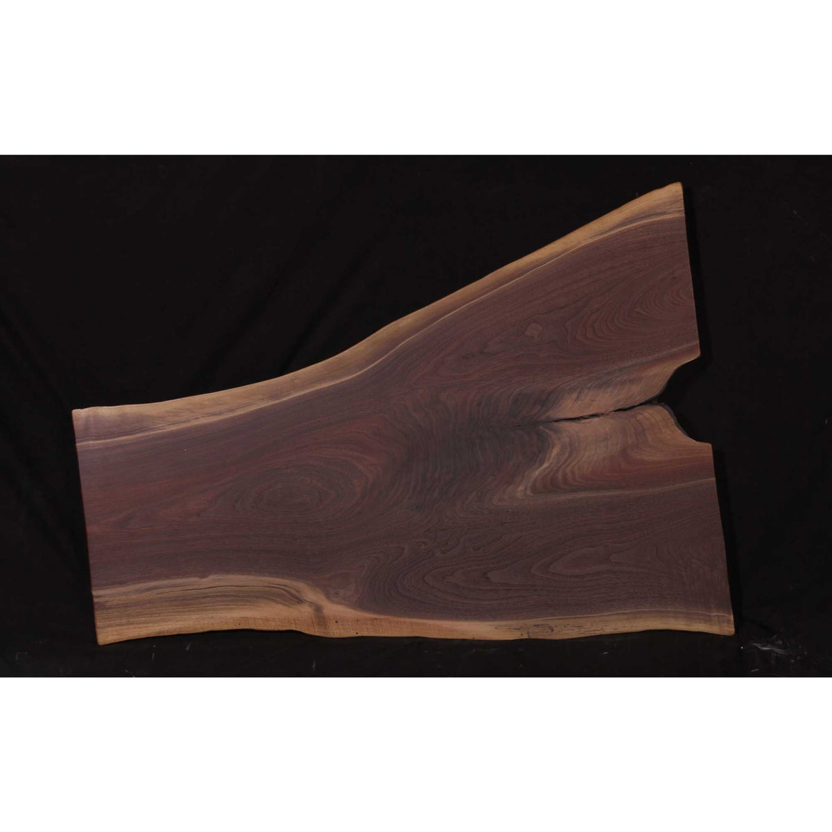 Walnut live edge coffee table slab about 52 inches long and 19 to 38 inches wide with natural wavy edges