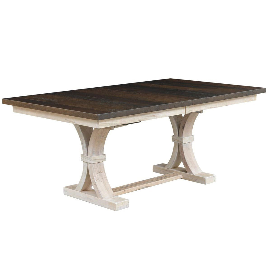 Extendable trestle dining table with a dark weathered top and whitewashed curved X trestle base on a white background