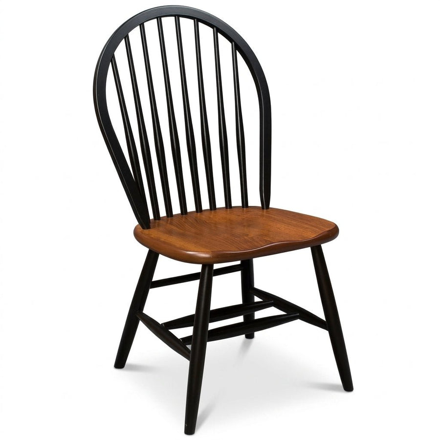 A classic spindle-back dining chair with a black painted frame and a warm brown wooden seat, shown against a plain white background.