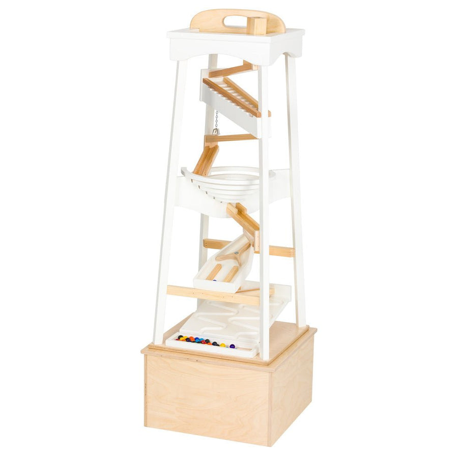 White marble pyramid run on a natural plywood stand box, with ramps, funnels and rows of colored marbles