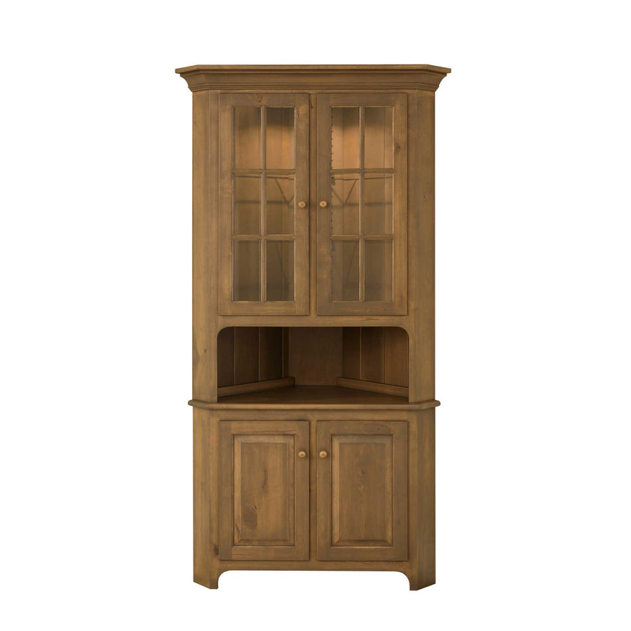 Honey stained corner hutch with two nine-pane glass doors, open display shelf and two paneled base doors