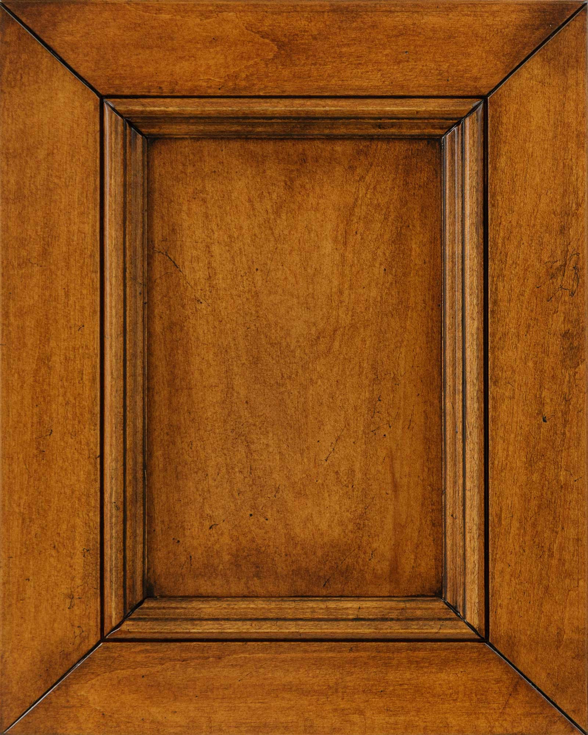Vintage Alverton stain on maple sample, a golden amber panel door with dark glazed molding and scattered distress specks