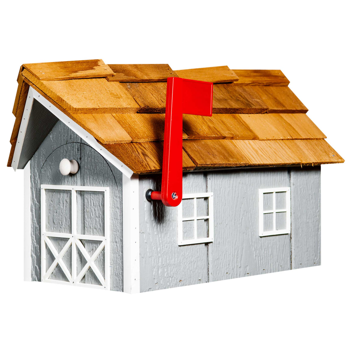 Light gray barn-style wood mailbox with white cross-braced doors, cedar shake roof and red mail flag
