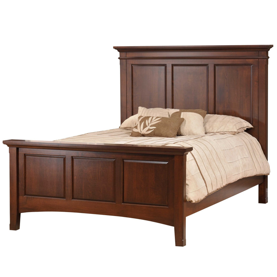 Dark cherry panel bed with a tall three-panel headboard, crown molding and matching paneled footboard