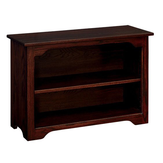 Short two-shelf bookcase in dark espresso stained oak with a shaped side profile and curved base cutout