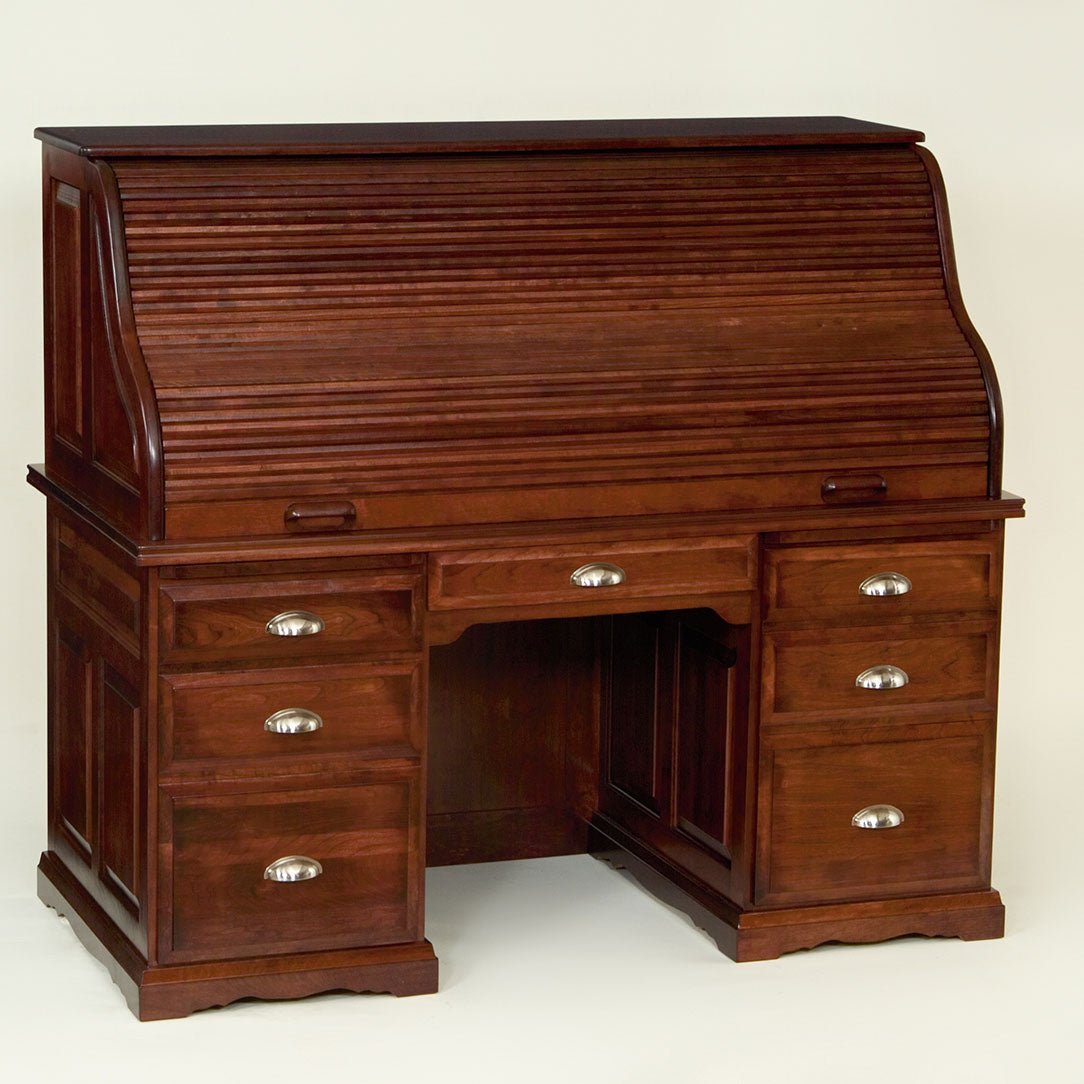Raised panel roll top desk in dark cherry with fluted tambour, six drawers and brushed nickel cup pulls